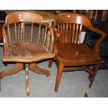 AN EARLY 20TH CENTURY REVOLVING CAPTAINS CHAIR WITH SPINDLE GALLERY BACK AND BRASS STUDDED