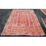 A KILIM STYLE FLATWEAVE CARPET, IN TONES OF RED, YELLOW AND IVORY, 290CM LONG X 170CM WIDE
