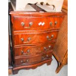 A SMALL REPRODUCTION MAHOGANY SERPENTINE CHEST OF FOUR DRAWERS