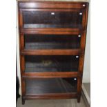AN EARLY 20TH CENTURY STAINED OAK FOUR SECTIONAL GLOBE WERNICKE STYLE BOOKCASE