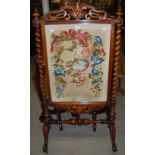 VICTORIAN ROSEWOOD FRAMED NEEDLEWORK UPHOLSTERED FIRE SCREEN WITH BARLEY TWIST COLUMNS.