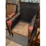 *A 19TH CENTURY OAK ARMCHAIR WITH UPHOLSTERED BACK AND ARMS, RAISED ON TAPERED OCTAGONAL SUPPORTS