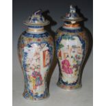 A PAIR OF CHINESE PORCELAIN BLUE AND WHITE JARS AND COVERS, QING DYNASTY, WITH FAMILLE ROSE ENAMEL