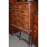 AN EARLY 18TH CENTURY WALNUT CHEST ON STAND, THE CHEST FITTED WITH THREE SMALL DRAWERS OVER THREE