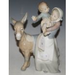 A LLADRO PORCELAIN FIGURE GROUP OF MOTHER, BOY AND DONKEY