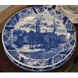 A PAIR OF DELFT BLUE AND WHITE PRINTED CHARGERS, ONE DECORATED WITH WINDMILL, THE OTHER HORSE,