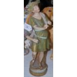 A LARGE EARLY 20TH CENTURY ROYAL DUX FIGURE OF BACCHUS, MODELLED AS A BOY IN CLASSICAL DRESS AND