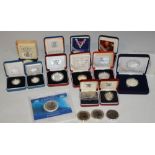 A MIXED LOT OF TWELVE ASSORTED CASED ROYAL MINT SILVER AND WHITE METAL PROOF COINS TOGETHER WITH