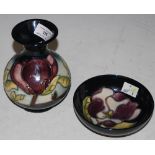 TWO PIECES OF MODERN MOORCROFT, INCLUDING A VASE AND PIN DISH, BOTH IN MAGNOLIA PATTERN ON A DARK