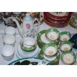 A PLANT TUSCAN GREEN GROUND PART TEA SET, TOGETHER WITH A BURLEIGHWARE ROSE DECORATED PART COFFEE