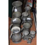 A COLLECTION OF ELEVEN ASSORTED ANTIQUE PEWTER TANKARDS