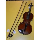 A 20TH CENTURY VIOLIN AND TWO BOWS
