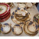 A COALPORT BLUE GROUND FLORAL DECORATED PART TEA SET TOGETHER WITH A COALPORT GREEN GROUND FLORAL