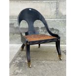 A 19TH CENTURY EBONISED KLISMOS TYPE CHAIR WITH CANE-WORK SEAT RAISED ON SHAPED TAPERED