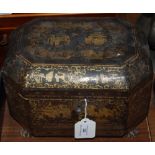 A 19TH CENTURY CHINESE LACQUERED OCTAGONAL SHAPED TEA CADDY ON FOUR PAW FEET