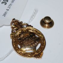 A 9CT GOLD PRESENTATION MEDALLION, TOGETHER WITH A YELLOW METAL SHIRT STUD STAMPED '9CT', GROSS