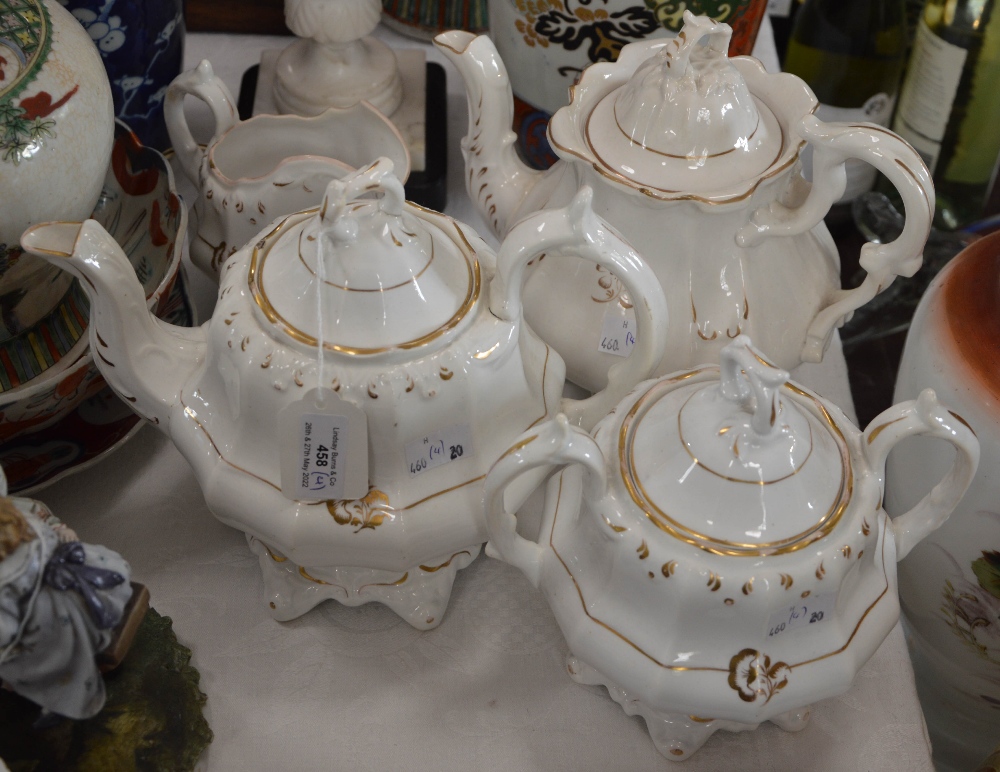 A VICTORIAN PART TEA SET COMPRISING TWO TEAPOTS AND COVERS, TWIN HANDLED SUGAR BOWL AND COVER,