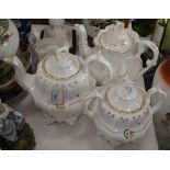 A VICTORIAN PART TEA SET COMPRISING TWO TEAPOTS AND COVERS, TWIN HANDLED SUGAR BOWL AND COVER,