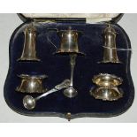 A CASED CHESTER SILVER FIVE PIECE CRUET SET