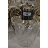 AN EARLY 20TH CENTURY EP MOUNTED CUT GLASS CLARET JUG