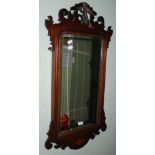 AN EARLY 20TH CENTURY MAHOGANY AND MARQUETRY WALL MIRROR IN THE GEORGIAN TASTE, WITH SCROLLING