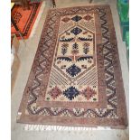 A PERSIAN STYLE LONG RUG, 20TH CENTURY, THE OFF-WHITE RECTANGULAR GROUND CENTRED WITH A LARGE