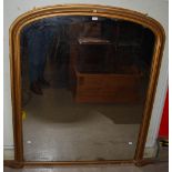 A LATE 19TH CENTURY GILT WOOD OVER MANTEL MIRROR OF RECTANGULAR FORM WITH ARCHED TOP