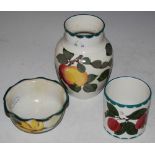 THREE WEMYSS WARE ITEMS, INCLUDING A SMALL FLUTED BOWL DECORATED WITH DAFFODILS, IMPRESSED '