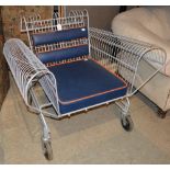 A LATE 1980'S / 1990'S SHOPPING TROLLEY CHAIR, THE LEATHERETTE BACK AND LOOSE CUSHION SEAT IN THE