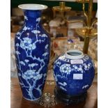 A CHINESE BLUE AND WHITE PORCELAIN VASE DECORATED WITH PRUNUS BLOSSOM ON CRACKED ICE GROUND TOGETHER