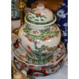 A CHINESE PORCELAIN CRACKLE GLAZED FAMILLE VERT JAR AND COVER, TOGETHER WITH A JAPANESE IMARI