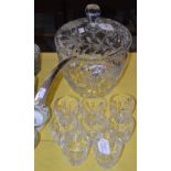 A LARGE CUT GLASS PUNCH BOWL AND COVER WITH WHEEL CUT DECORATION OF FLOWERS AND FOLIAGE, TOGETHER