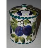 A WEMYSS WARE JAR AND COVER, DECORATED WITH DAMSONS, GREEN PAINTED 'WEMYSS, T. GOODE & CO' MARK TO