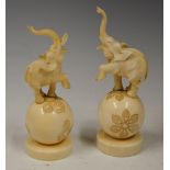 AN EARLY 20TH CENTURY PAIR OF JAPANESE CARVED IVORY OKIMONO, PROBABLY TAISHO PERIOD, MODELLED AS
