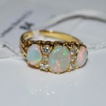 A VINTAGE 18CT GOLD OPAL AND DIAMOND NINE STONE RING, SIZE P