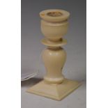 A LATE 19TH CENTURY CARVED IVORY CANDLESTICK, PROBABLY FRENCH, POSSIBLY DIEPPE, OF TURNED FORM