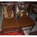 SET OF FOUR GEORGE III MAHOGANY DINING CHAIRS, THE TOP RAILS CARVED WITH HO-HO BIRDS AND FOLIAGE