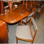 A MID-CENTURY TEAK DINING ROOM SUITE BY 'A.H. McINTOSH & Co. KIRKCALDY', COMPRISING SIDEBOARD, TABLE