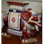 ORNAMENTAL CERAMIC ELEPHANT STOOL WITH BROWN, BLUE AND YELLOW COLOURED GLAZE