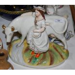 A 19TH CENTURY STAFFORDSHIRE POTTERY FIGURE OF A COW AND MILKMAID