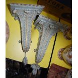 A PAIR OF EARLY 20TH CENTURY GREEN AND GILT PAINTED WALL BRACKETS, FORMED FROM STYLISED LEAVES,