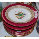 A ROYAL WORCESTER PUCE GROUND HAND PAINTED PART FRUIT SET COMPRISING FIVE PLATES, TWO LOW