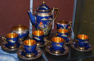 A CARLTONWARE BLUE GROUND CHINOISERIE DECORATED COFFEE SET