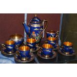 A CARLTONWARE BLUE GROUND CHINOISERIE DECORATED COFFEE SET