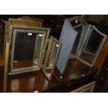 TWO ASSORTED 20TH CENTURY TRIPLE-PLATE DRESSING TABLE MIRRORS, ONE WITH GILDED FINISH, THE OTHER