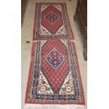 A PAIR OF 20TH CENTURY INDIAN HAND KNOTTED PERSIAN STYLE RUGS, THE OFF-WHITE RECTANGULAR FIELD