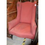 A LATE 19TH / EARLY 20TH CENTURY MAHOGANY WINGBACK ARMCHAIR WITH PUCE UPHOLSTERED BACK, ARMS AND