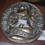 A 19TH CENTURY FRENCH BRONZE CIRCULAR PLAQUE CAST IN RELIEF WITH THE HEAD OF A BULL, INSCRIBED 'JOYE