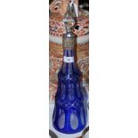 A LATE 19TH CENTURY WHITE METAL MOUNTED CLEAR AND BLUE GLASS CONICAL SHAPED DECANTER AND STOPPER