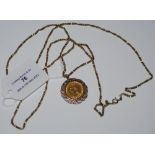 A VICTORIAN GOLD HALF SOVEREIGN DATED 1892 IN 9CT GOLD MOUNT SUSPENDED FROM YELLOW METAL CHAIN,